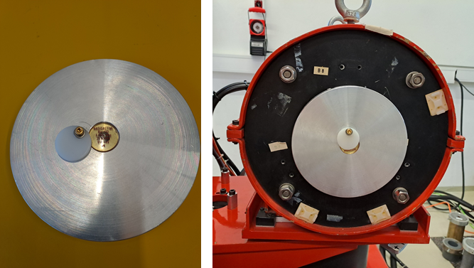 Photos of the source holder with inserted point source standard (left) and the holder mounted at the output of the collimator (right).