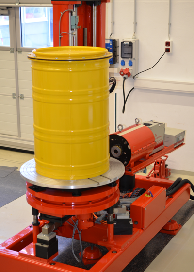 Photo of a typical segmented gamma scanner with an electro-cooled HPGe detector measuring a 200 L waste container.